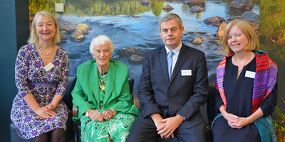 four people sitting for photo