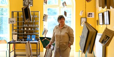 A woman standing in a yellow room in the James Joyce museum