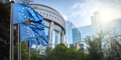3 EU flags outside the European Parliament in Brussels