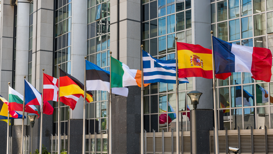 EU member state flags flying outside an EU building