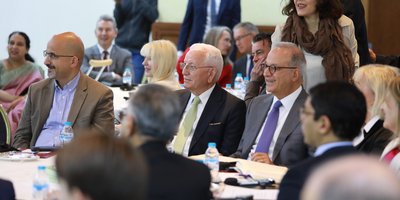 A group watching a speaker at a conference
