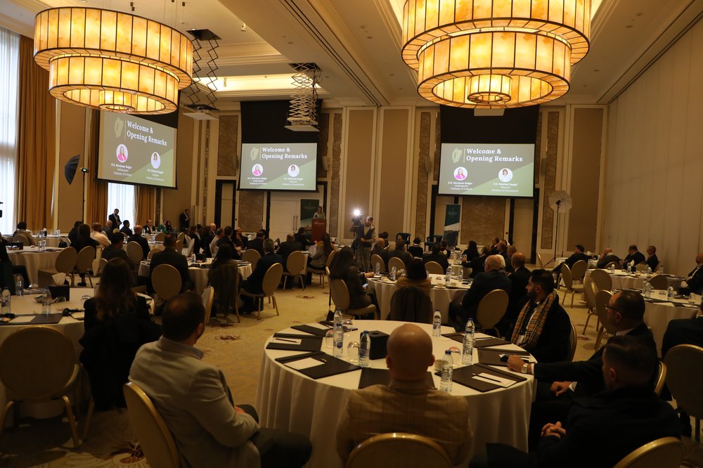 Conference attendees seated at the event listing to the key note speech