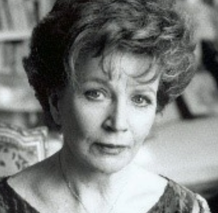 Woman in a library staring at the camera