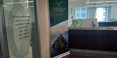 Image of the lobby of the Embassy building with harp signage.