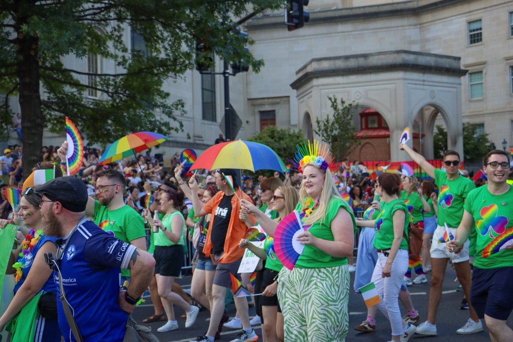 Embassy staff and Irish community members dressed in bright green and rainbow march in Capital Pride