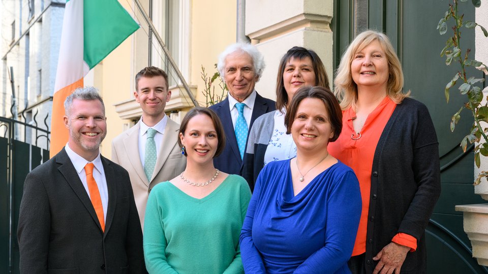 Two men and four women posing on the steps outside of the Embassy of Ireland, Bulgaria