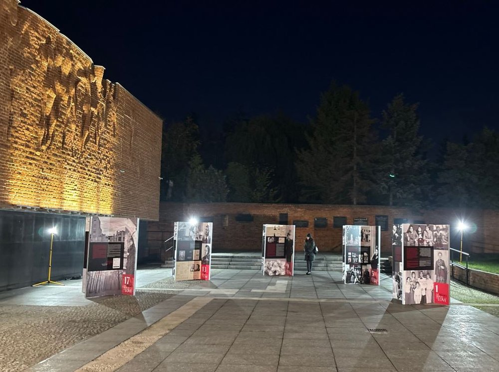 An outdoor exhibition with panels displayed in a middle of a square