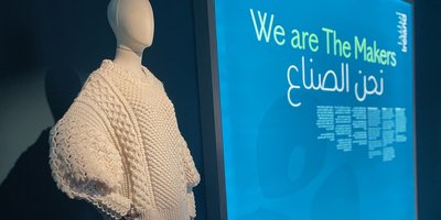 A cream Aran jumper on a mannequin.