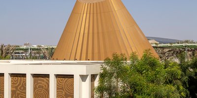 The gold, offset cone shaped roof structure of the Oculus area of the Irish Pavilion at Expo 2020.