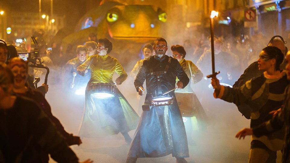 parade at night with drummers and lights