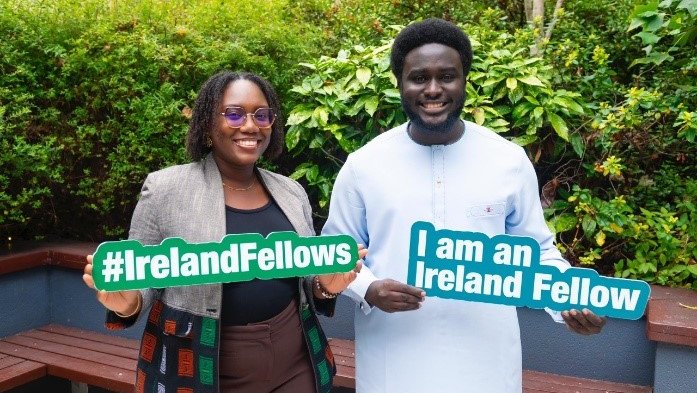 Two Senegalese fellows holding signs