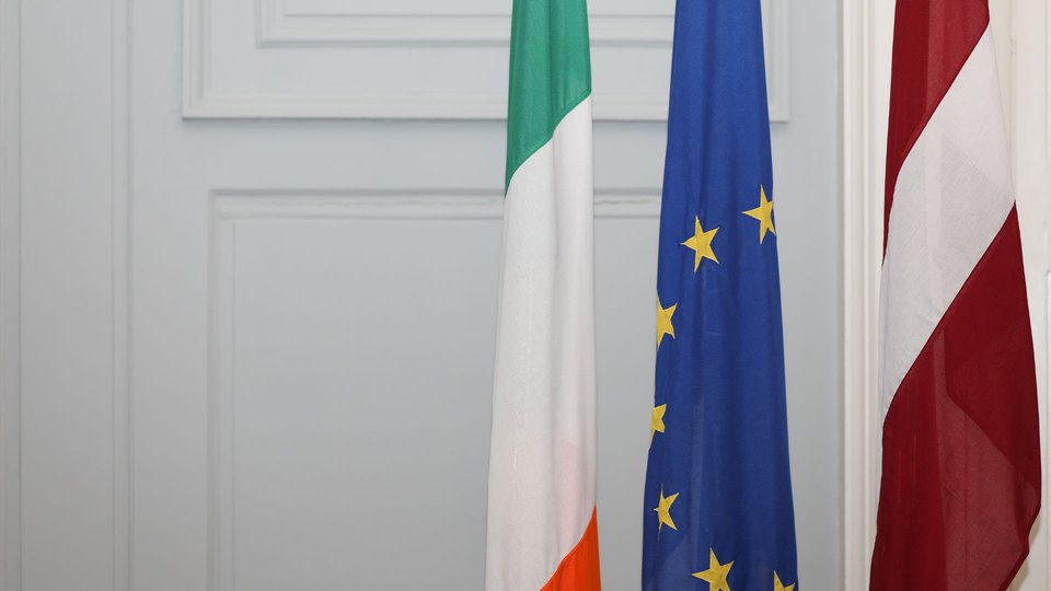 Irish, EU and Latvian flags.