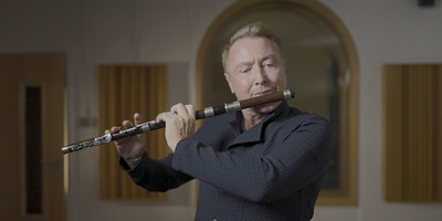 Man playing black Irish flute