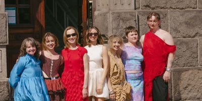 Image of panelists, designers, Ambassador McCullough and Embassy Staff