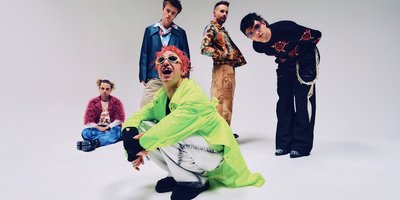 Fontaines DC photoshoot on a white studio background.