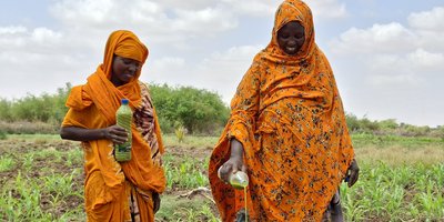 Gabay and her daughter Isnina, in Somalia's Dollow District, prepare organic pesticides to control pests and diseases on their farm.