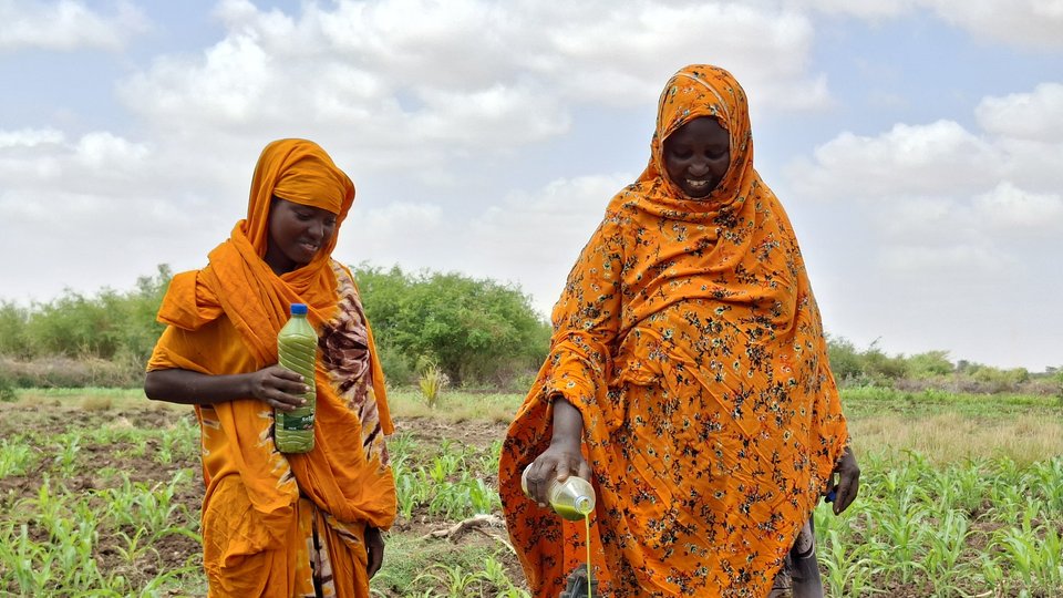 Gabay and her daughter Isnina, in Somalia's Dollow District, prepare organic pesticides to control pests and diseases on their farm.