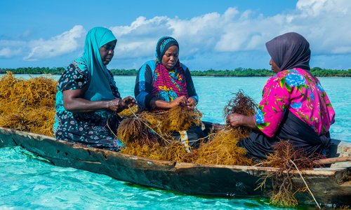Three women in a boat in Tanzania
