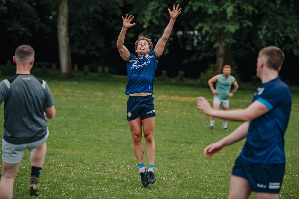 Player jumping for a ball during a Gaelic football match
