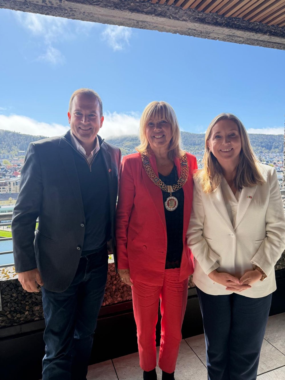 Honorary Consul to Ireland in Norway, Gavin Collins with Ambassador Buckley and Mayor of Bergen in front of a mountain view