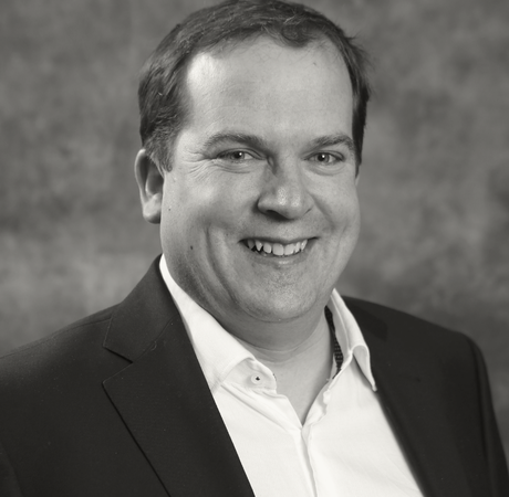 A headshot of Gavin Collins