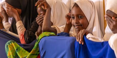 Amina, Sarah and Fartun taking part in the title selection for their story at the reading club in Diilin Primary School, Nugal region, Puntland State, Somalia.