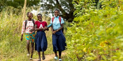 Three girls walking to school in Mozambique.
