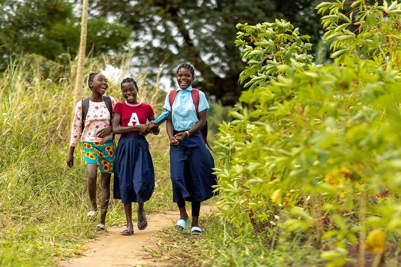 Three girls walking to school in Mozambique.