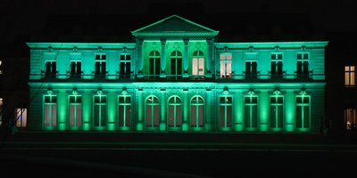 The OECD Chateau lit up in green for St Patrick's Day.