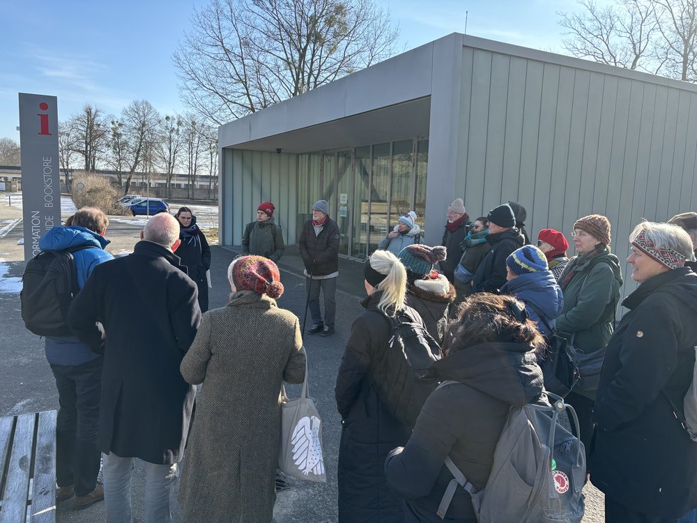 Tour group standing outside the Ravensbruck Memorial Centre