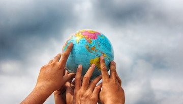 Hands on a globe