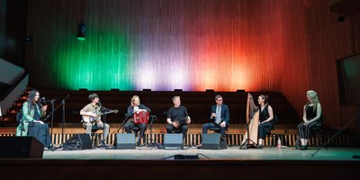 All of the artists with the Irish flag as the backdrop