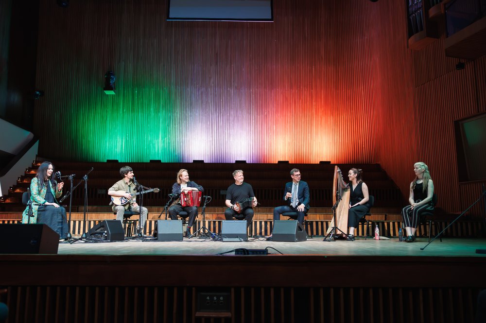 All of the artists with the Irish flag as the backdrop