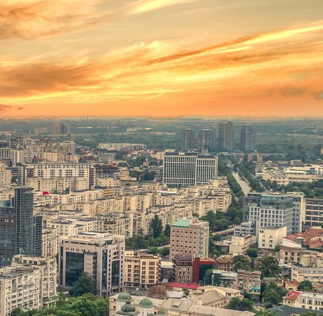 View of the skyline of Bucharest at sunset.