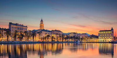 A view of Split from the water at sunset.
