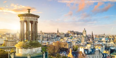 The Consulate building, a Georgian style yellow brick building with Irish and EU flags outside.
