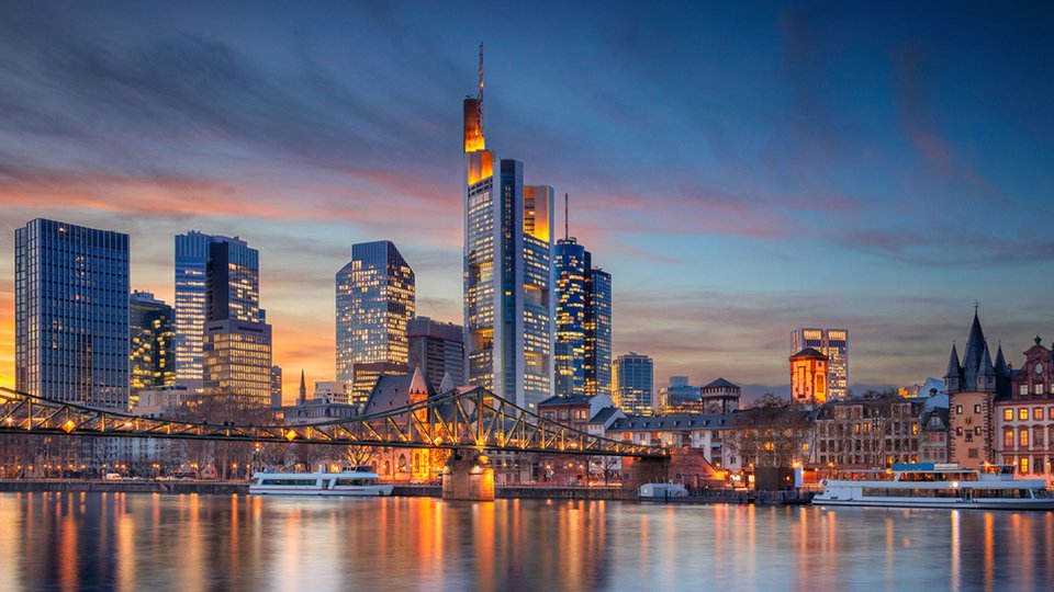 Frankfurt's skyline lit up at dusk.