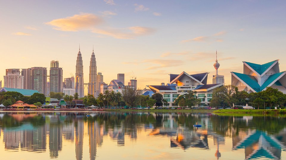 A skyline photograph of Kuala Lumpur at sunrise