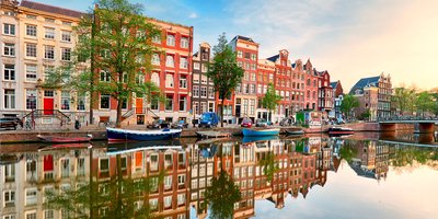 River and building during the day in the Netherlands