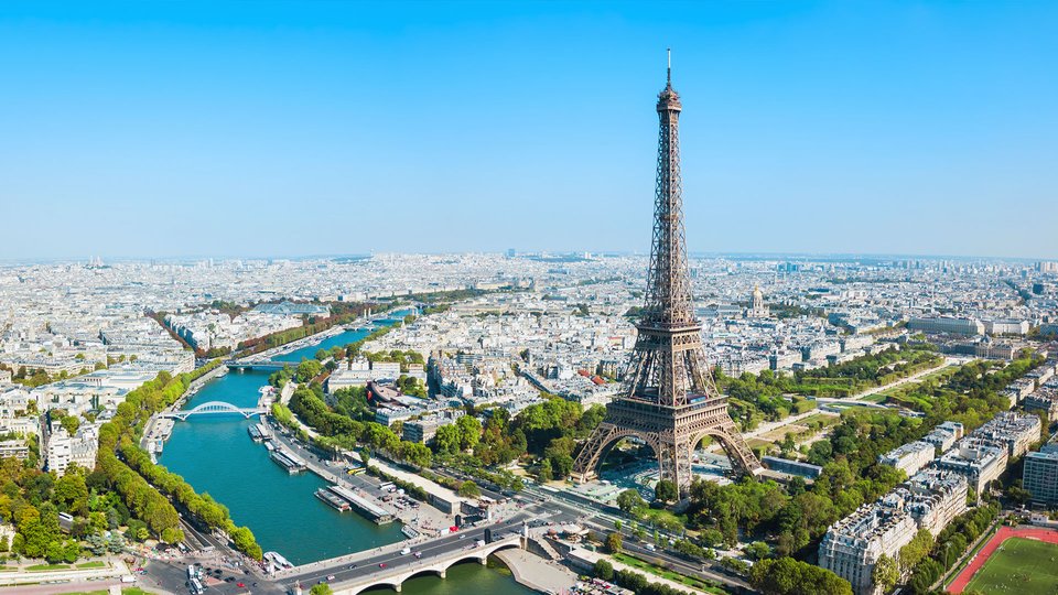 View of Paris's skyline with the focus on the Eiffel Tower and the river Seine.