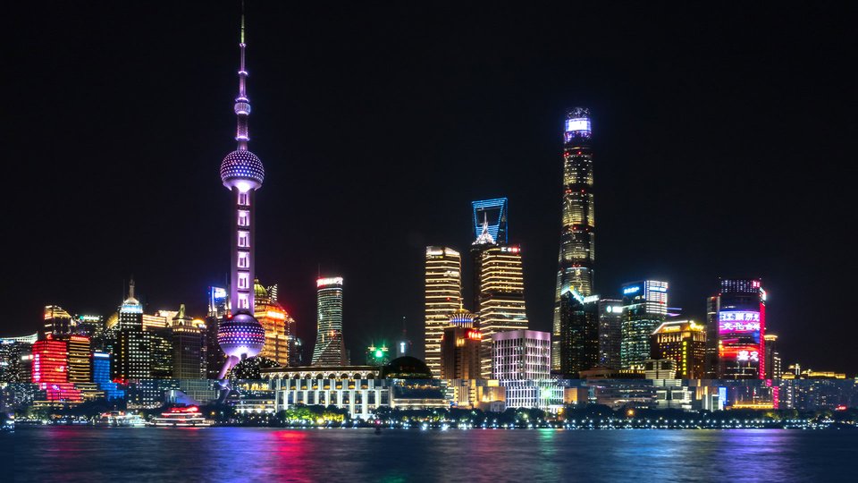 View of the skyline of Shanghai lit up at night.
