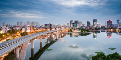 View of skyline of Vietnam across a bridge.