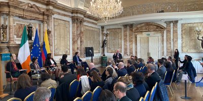 An audience watching a panel discussion.