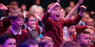 children celebrate winning a prize