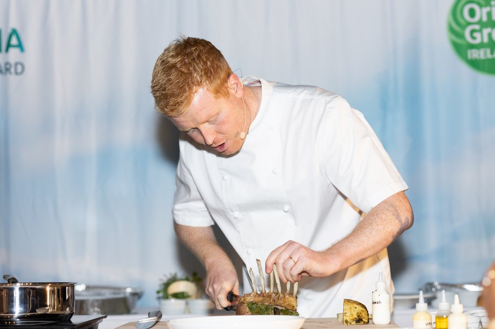 Chef Mark Moriarty cooking lamb on stage