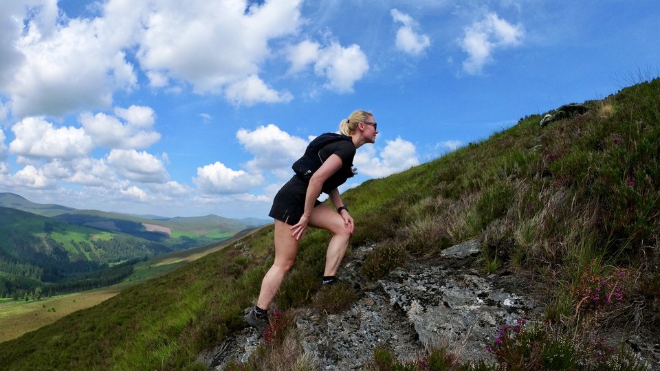 Ivana Kolaric climbing a mountain on a sunny day