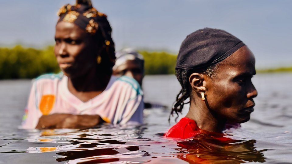 Two women in water.