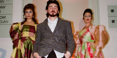 Oran O'Reilly on the runway with two of his models