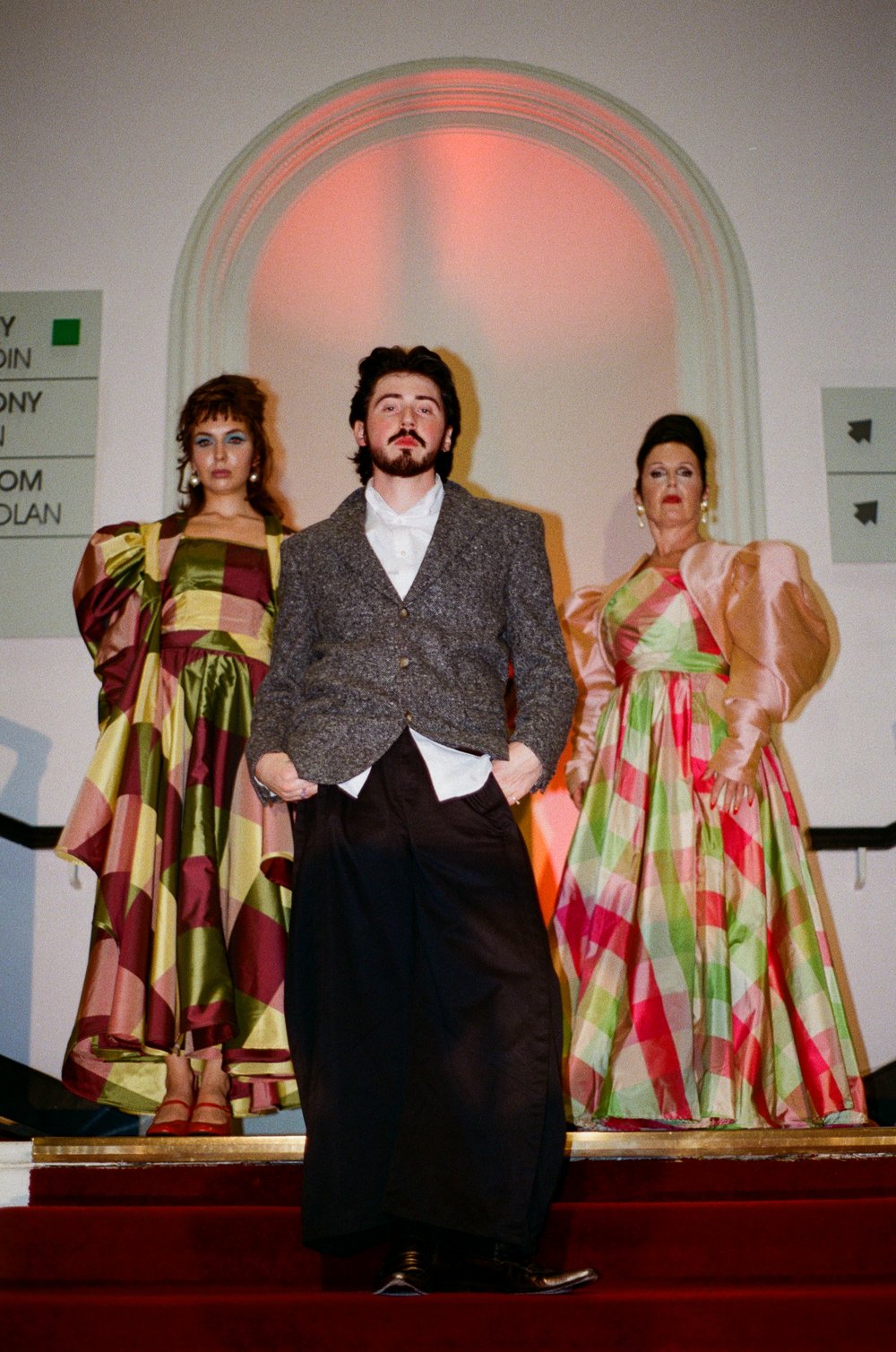 Oran Aurelio with two models on the runway