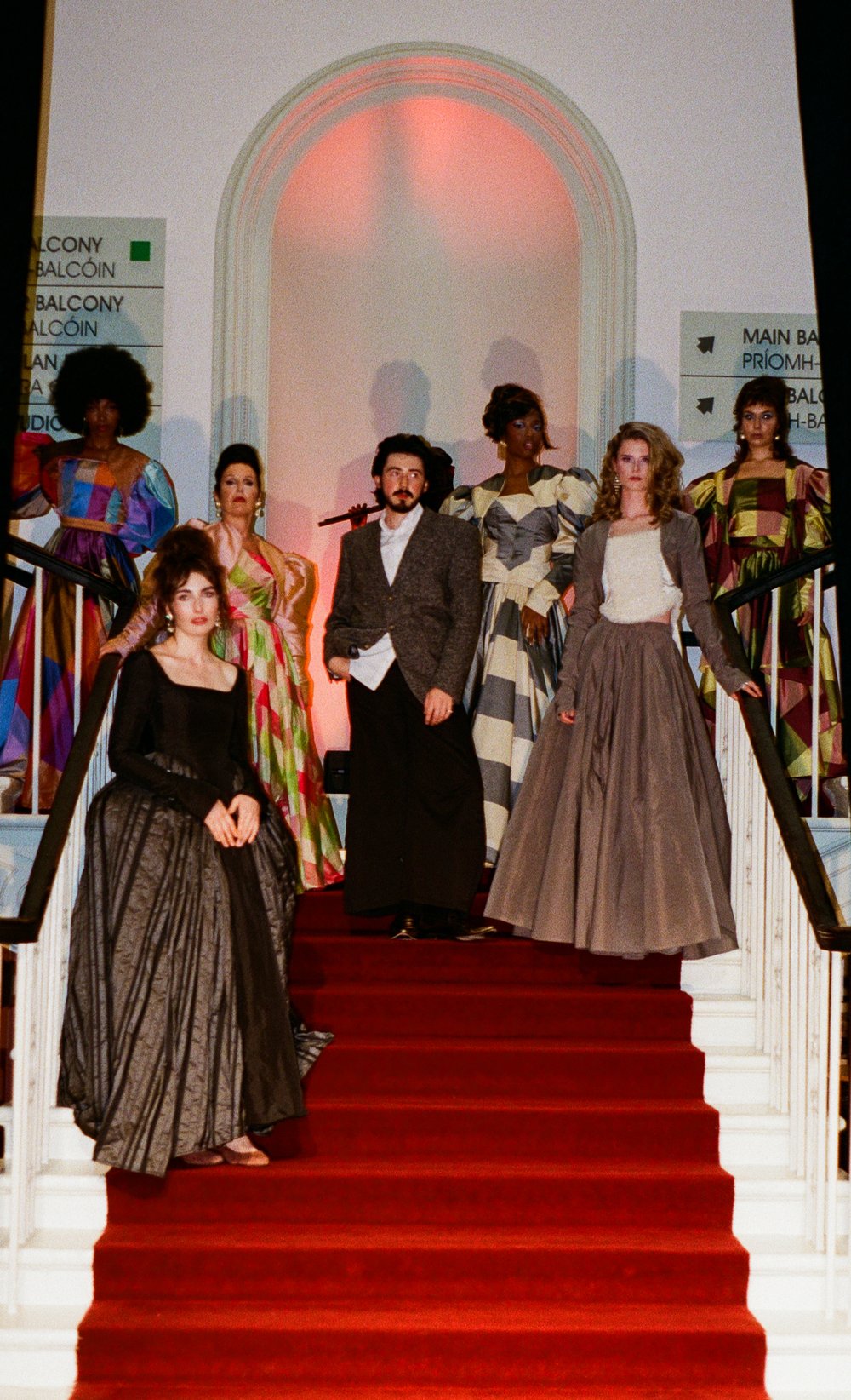 Oran O'Reilly and models standing on runway at the end of the fashion show